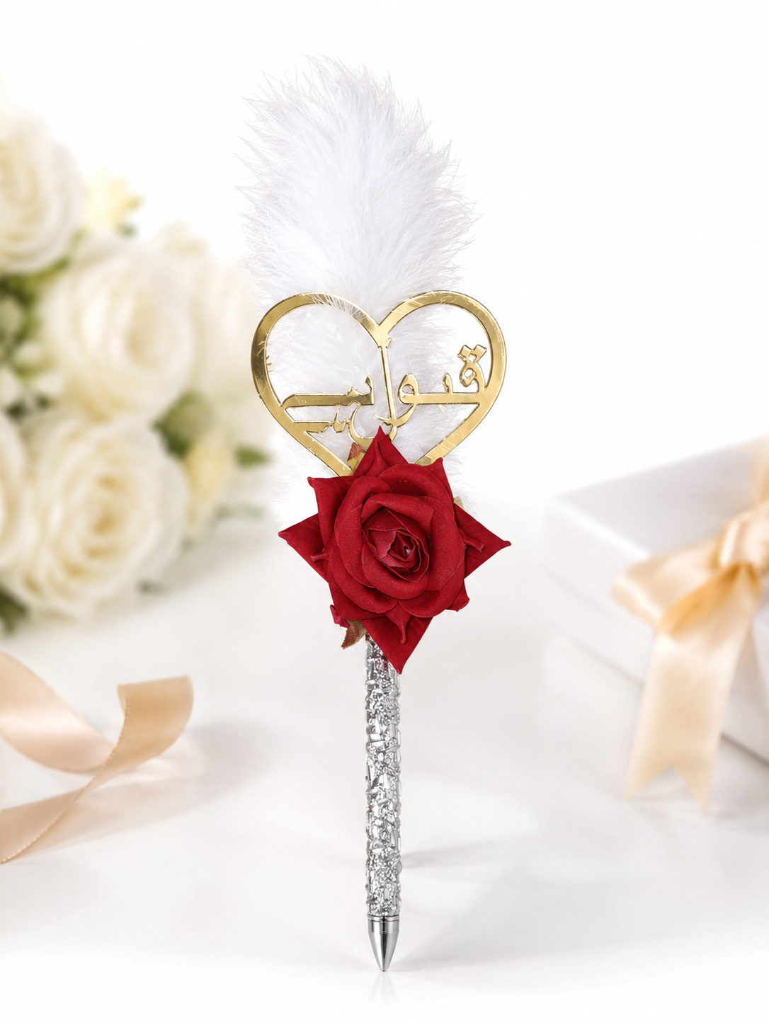 Decorative Qubool Hai Nikah Pen with a gold heart charm, red rose, white feather topper, and silver handle, perfect for Islamic wedding ceremonies, marriage signing, and bridal keepsake. Decorative Qubool Hai Nikah Pen with a gold heart charm, red rose, white feather topper, and silver handle, perfect for Islamic wedding ceremonies, marriage signing, and bridal keepsake.
