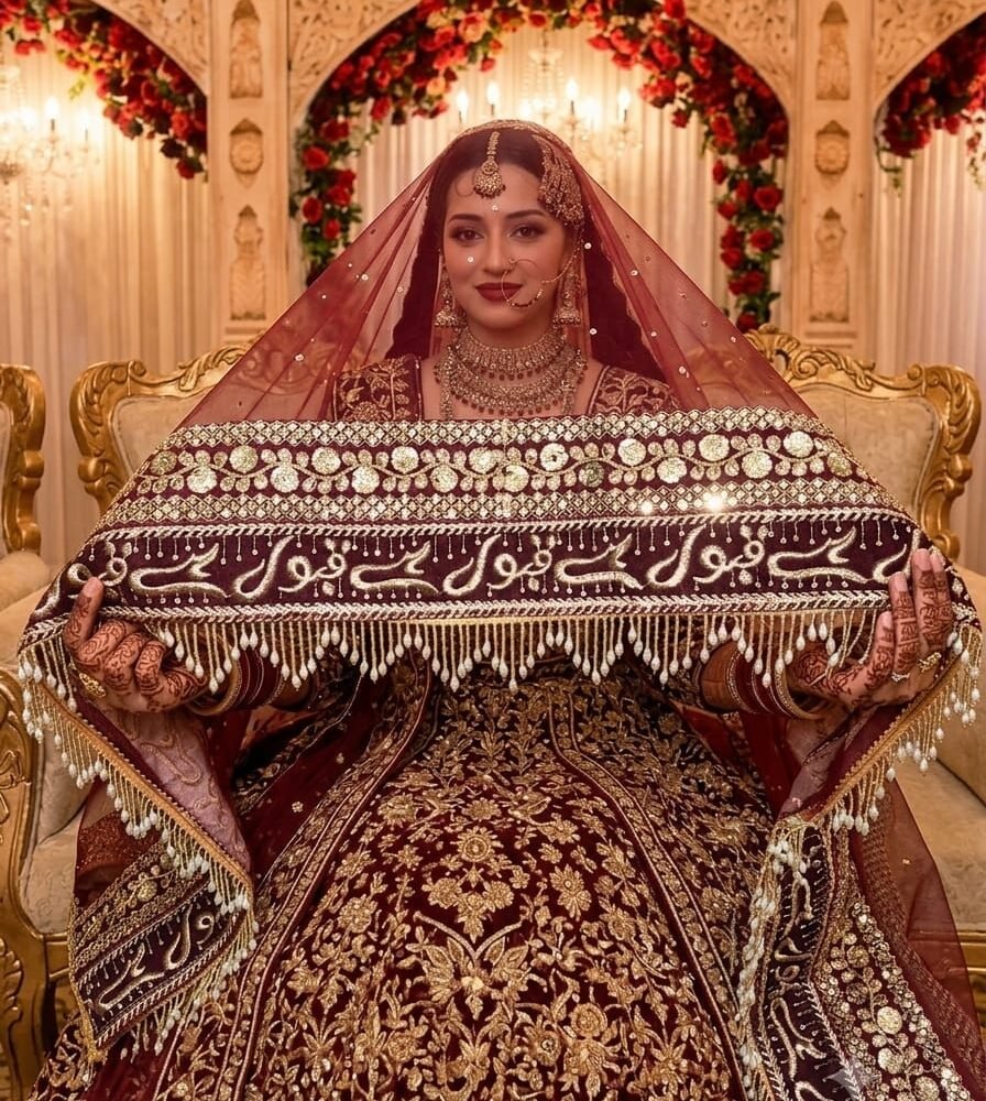 Elegant maroon Muslim bridal dupatta with intricate gold embroidery, shimmering sequins, floral border, and beaded fringe. Perfect for Nikah ceremonies, Islamic weddings, and traditional bridal wear.